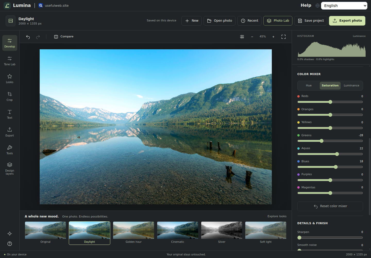 Lumina editing an alpine lake photo with the Daylight look, a live histogram and the eight-band HSL color mixer lowering green and raising aqua and blue saturation